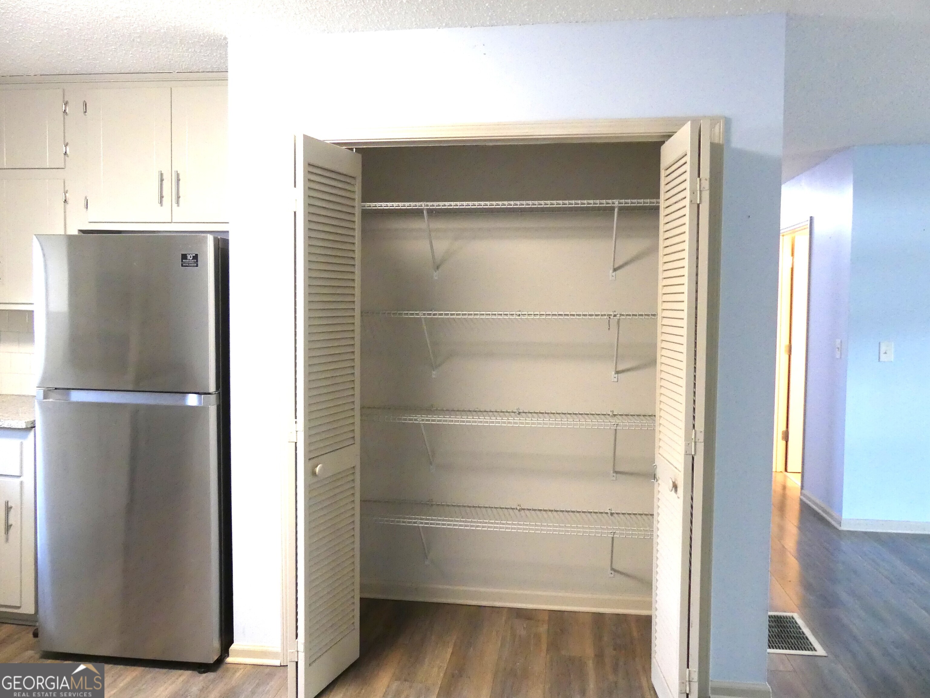 185 Stancil Drive Toccoa, GA 30577 - Photo 16 of 36 a view of walk in closet with empty racks