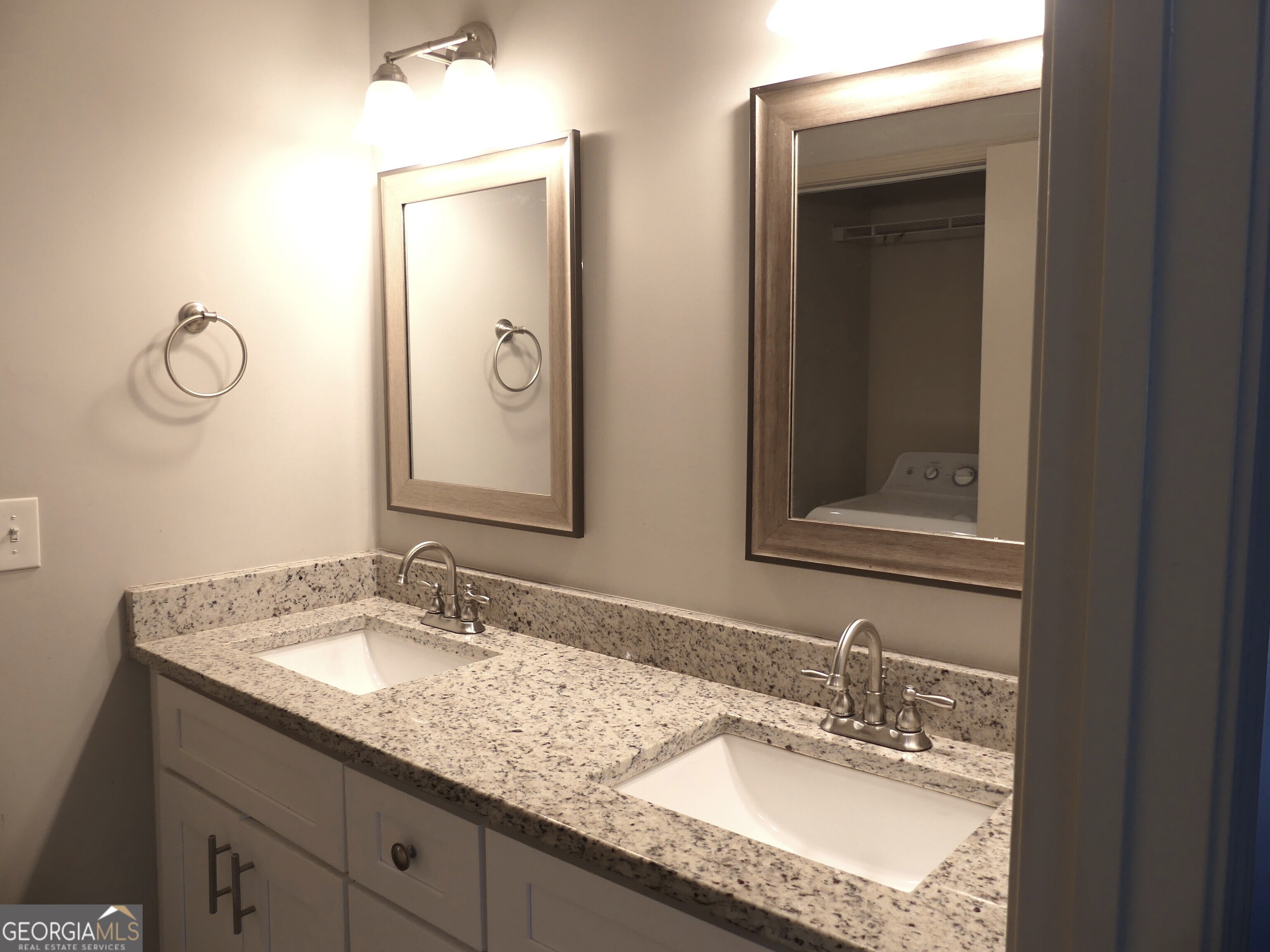 185 Stancil Drive Toccoa, GA 30577 - Photo 22 of 36 a bathroom with double vanity sinks and a mirror
