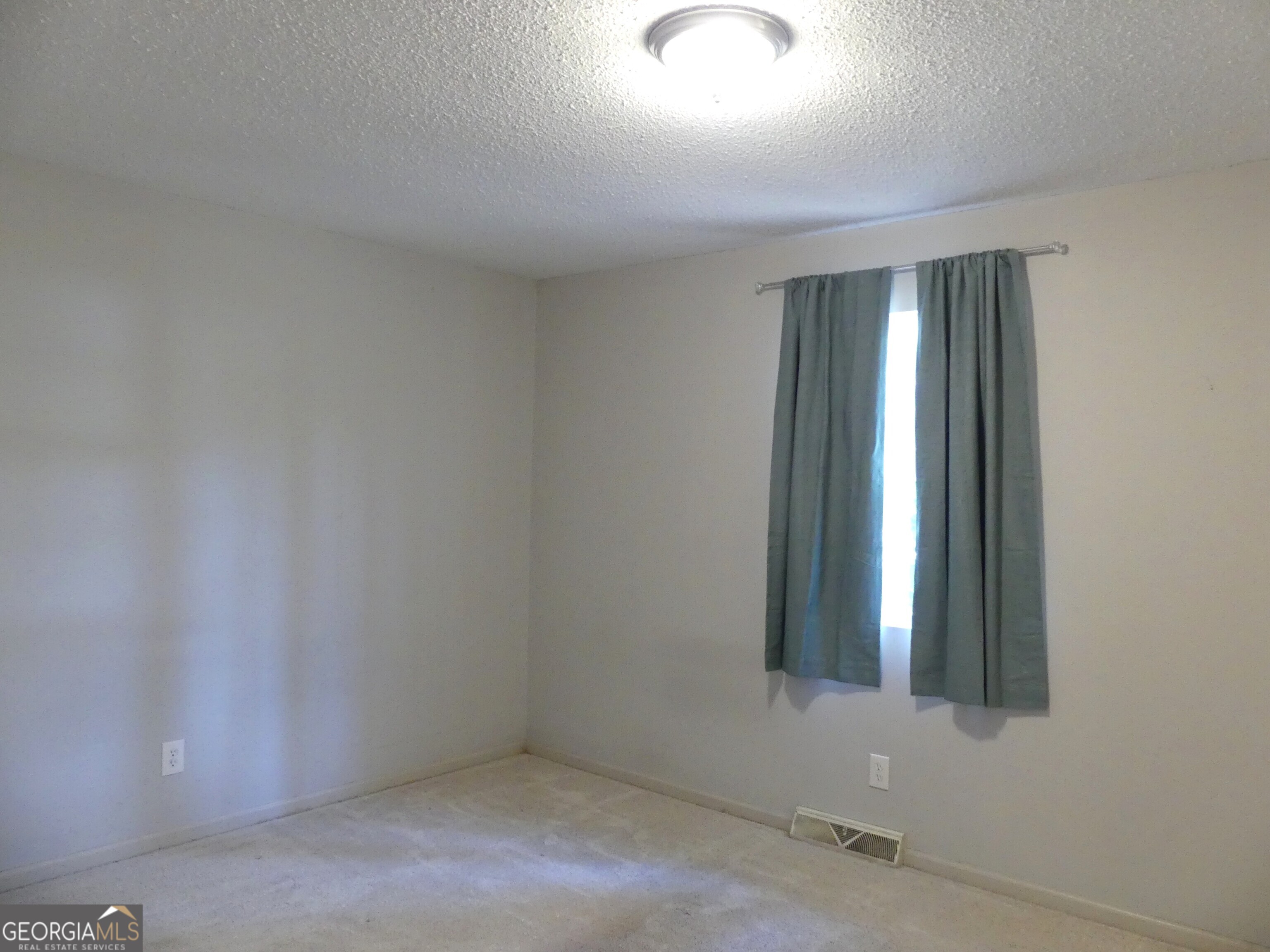 185 Stancil Drive Toccoa, GA 30577 - Photo 29 of 36 an empty room with windows