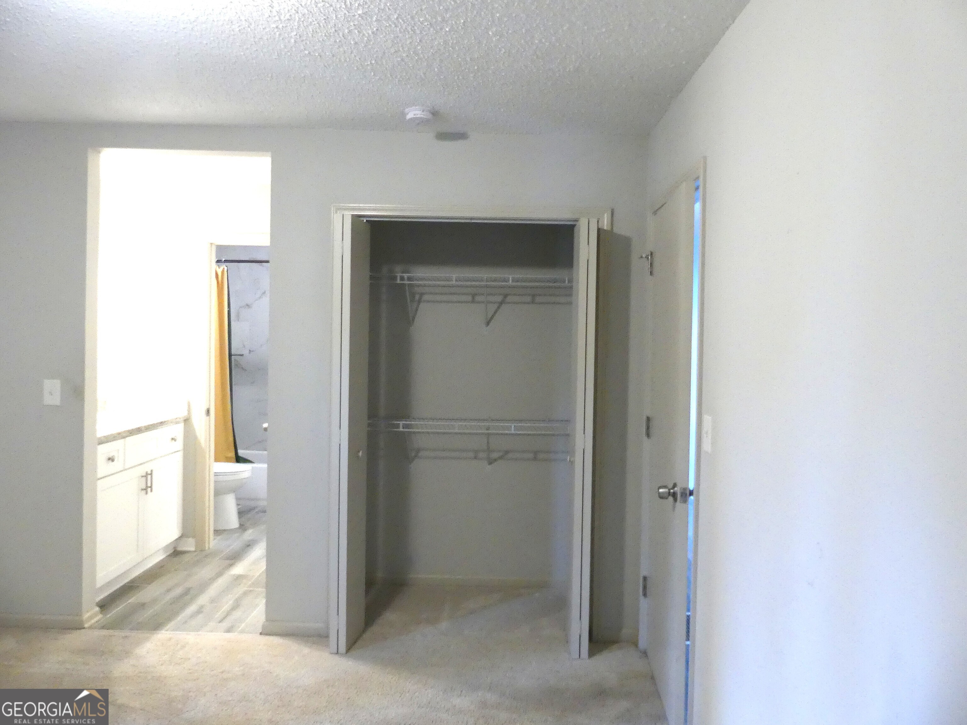 185 Stancil Drive Toccoa, GA 30577 - Photo 31 of 36 a bathroom with a glass door shower and a sink