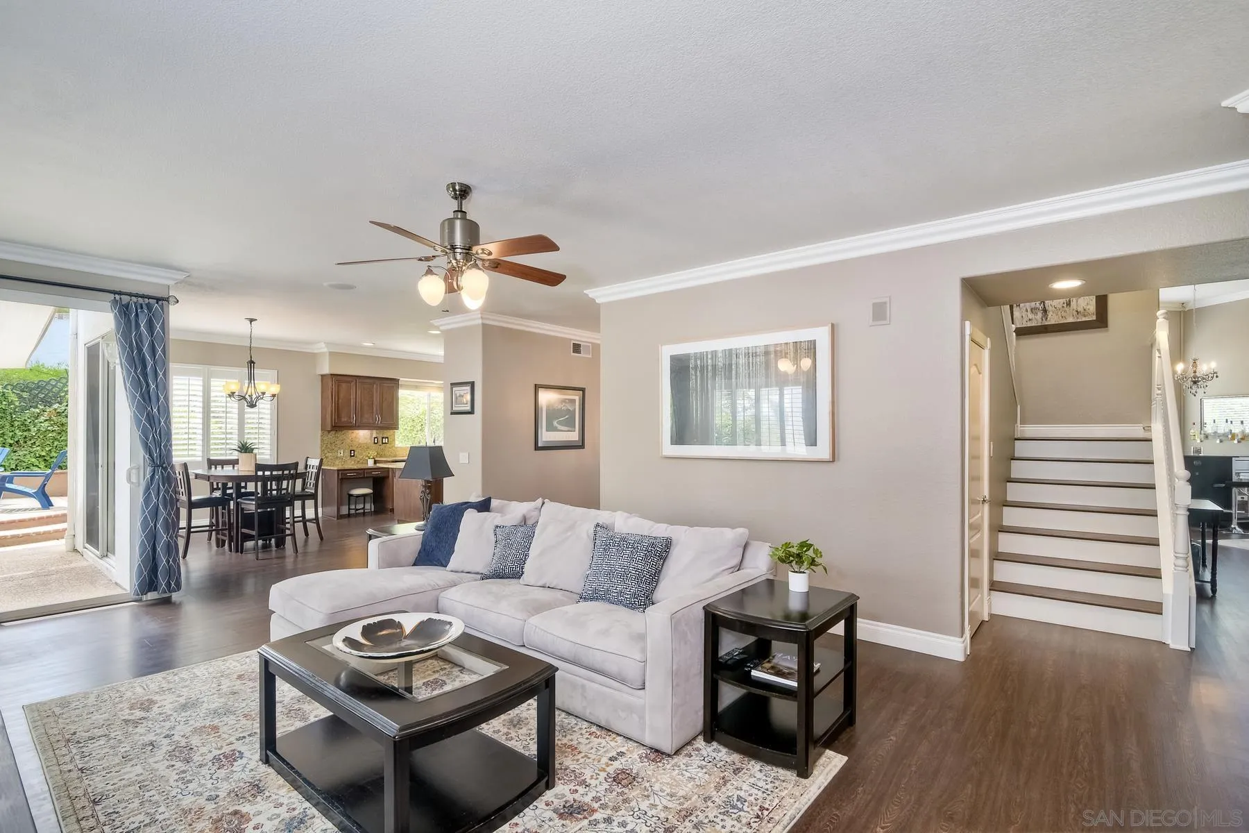 3670 Sutter Court Oceanside, CA 92056 - Photo 13 of 43 a living room with furniture a table and wooden floor