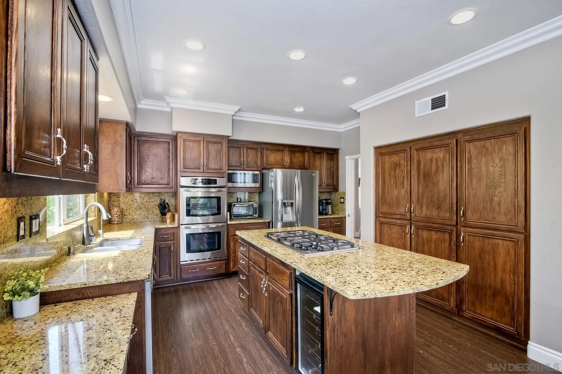 3670 Sutter Court Oceanside, CA 92056 - Photo 18 of 43 a kitchen with stainless steel appliances granite countertop a sink stove and refrigerator
