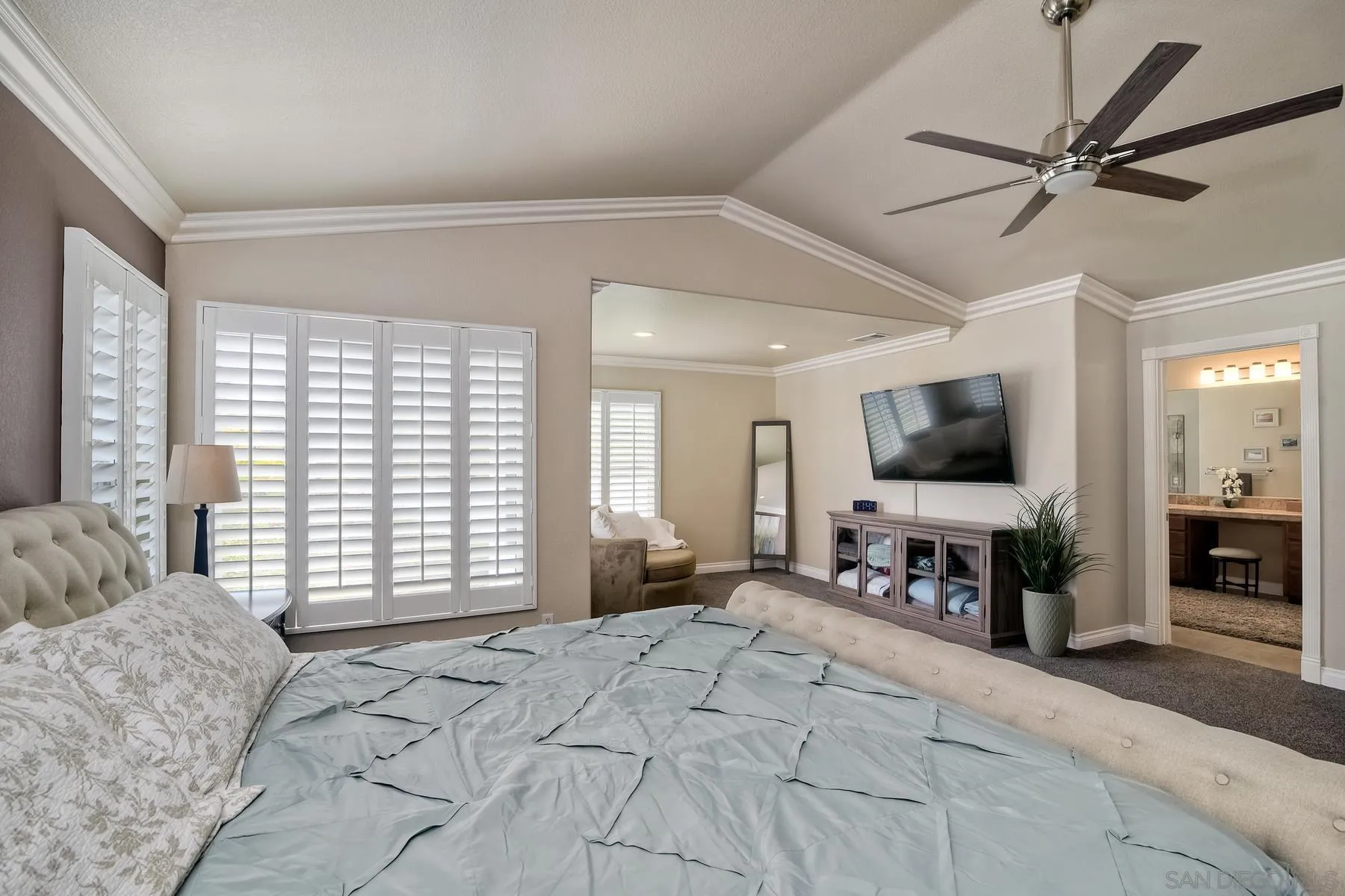 3670 Sutter Court Oceanside, CA 92056 - Photo 21 of 43 a bedroom with a large bed a flat screen tv and a large window