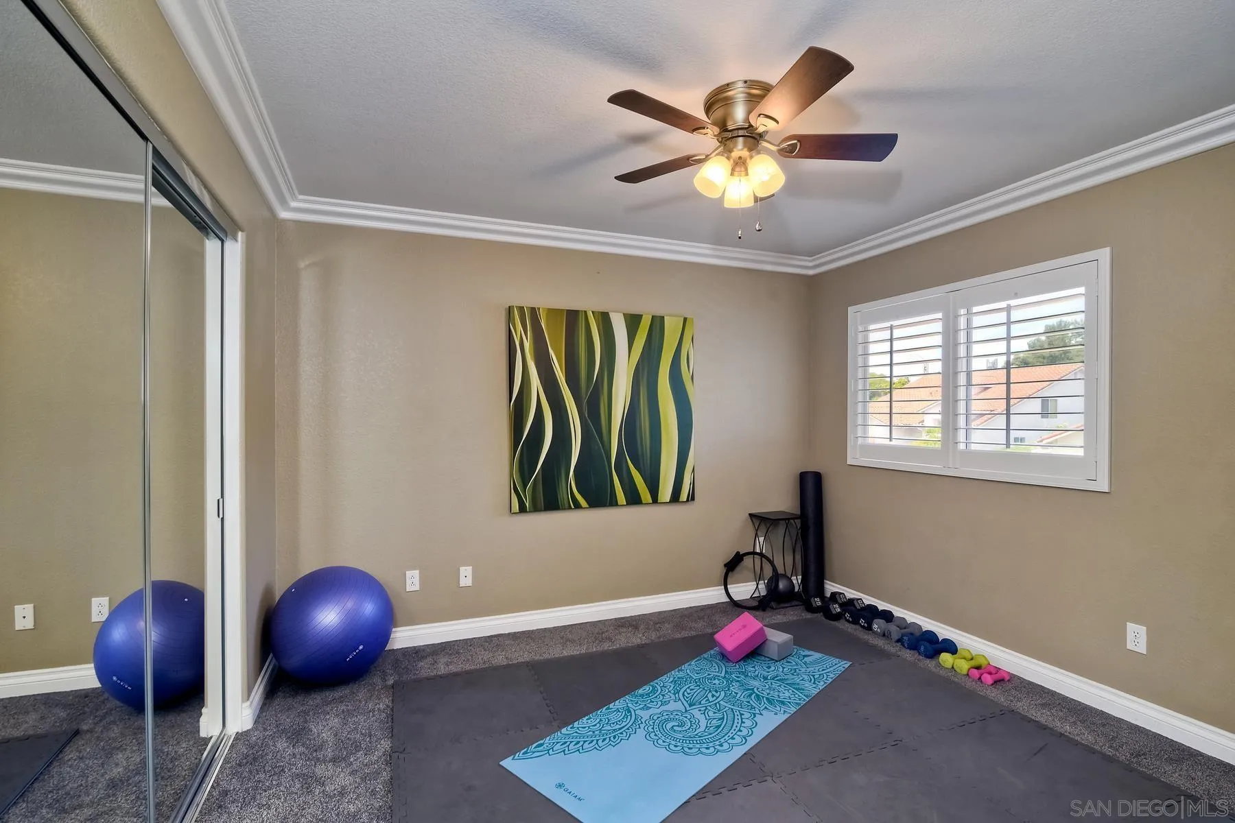 3670 Sutter Court Oceanside, CA 92056 - Photo 28 of 43 a room with window and chandelier fan