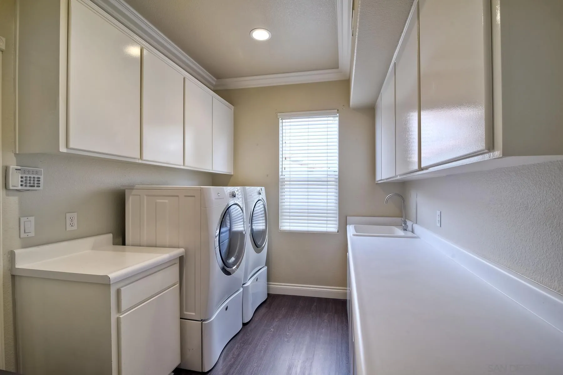 3670 Sutter Court Oceanside, CA 92056 - Photo 30 of 43 a view of storage and utility room with washer and dryer