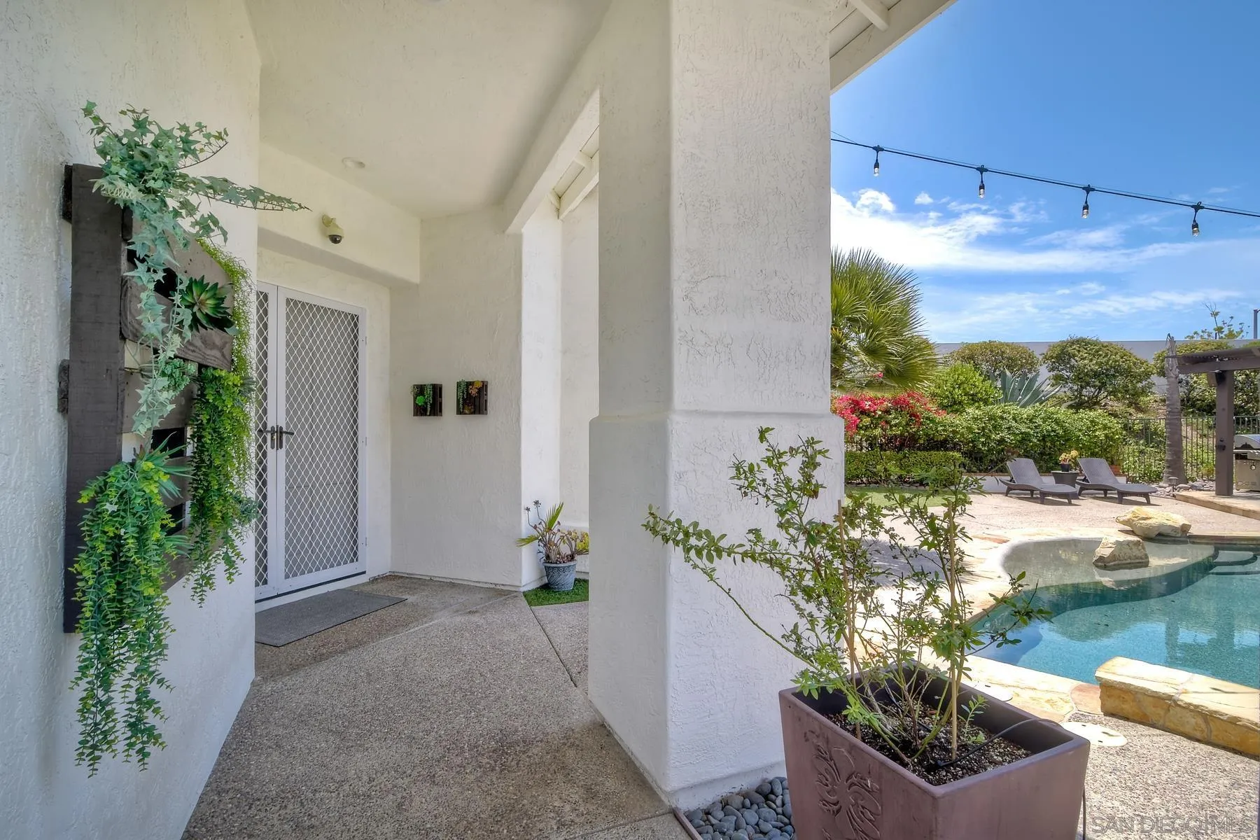 3670 Sutter Court Oceanside, CA 92056 - Photo 31 of 43 a front view of a house with lake view and a potted plant