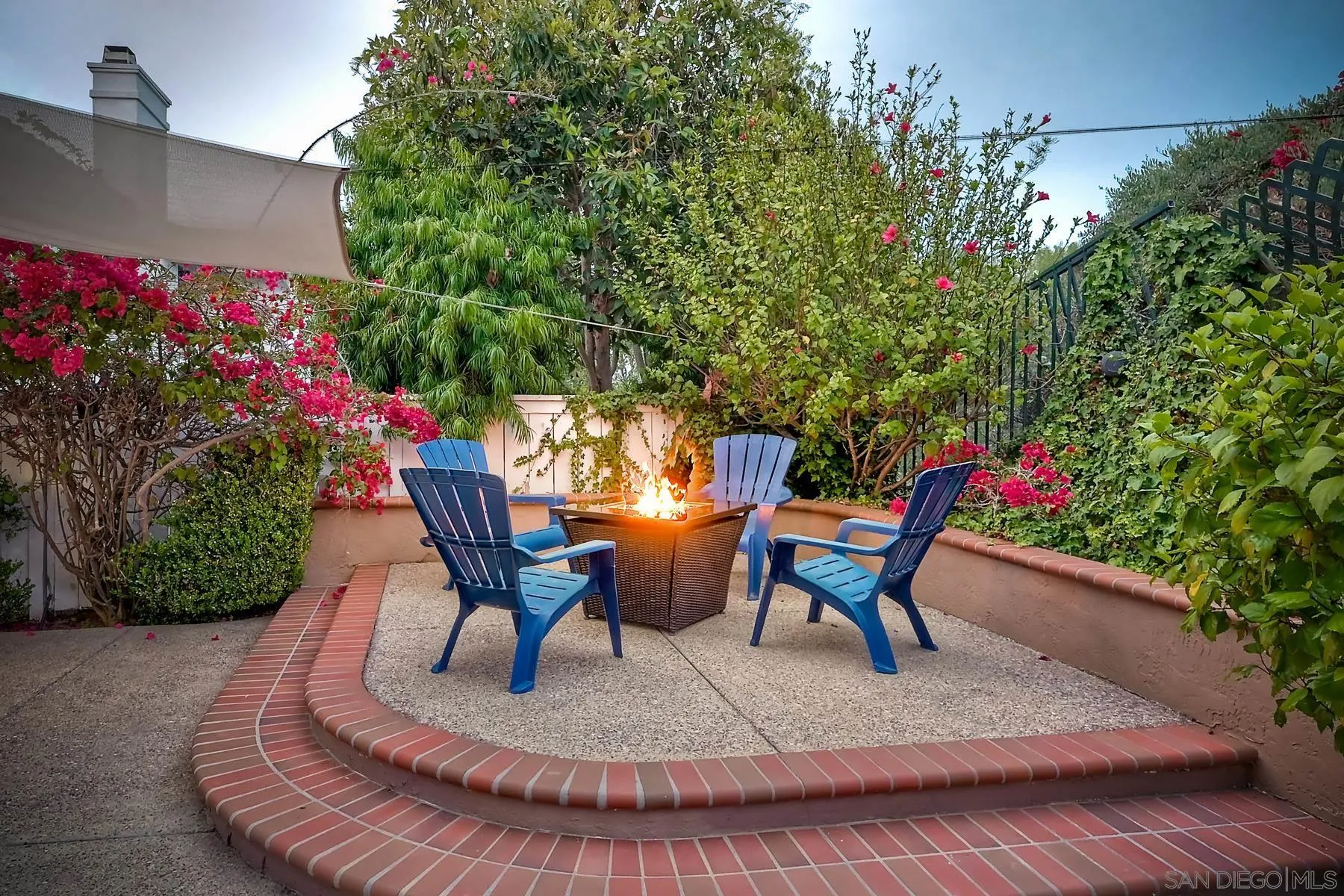 3670 Sutter Court Oceanside, CA 92056 - Photo 38 of 43 a lawn chair sitting in a backyard with potted plants