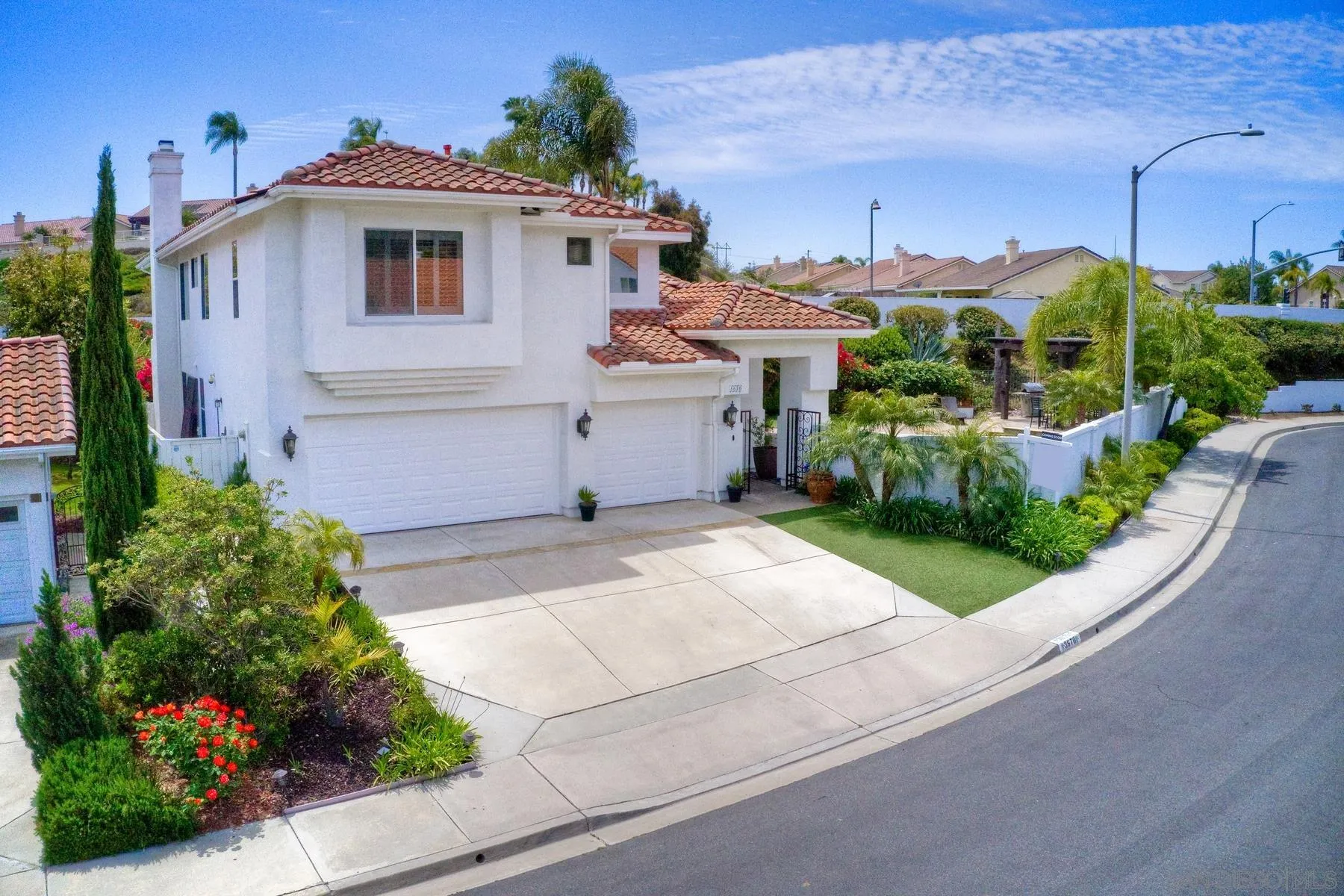 3670 Sutter Court Oceanside, CA 92056 - Photo 4 of 43 a front view of a house with a yard and garage