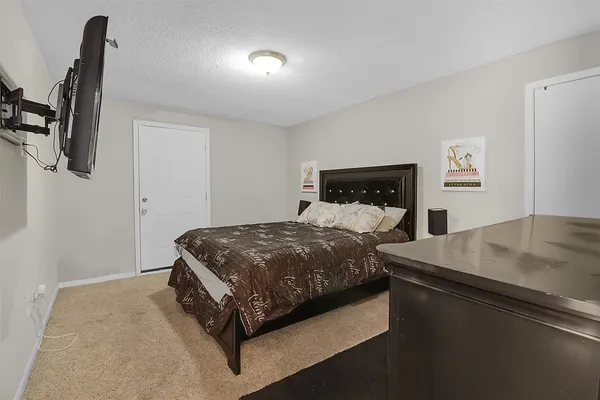 a bedroom with a bed and window