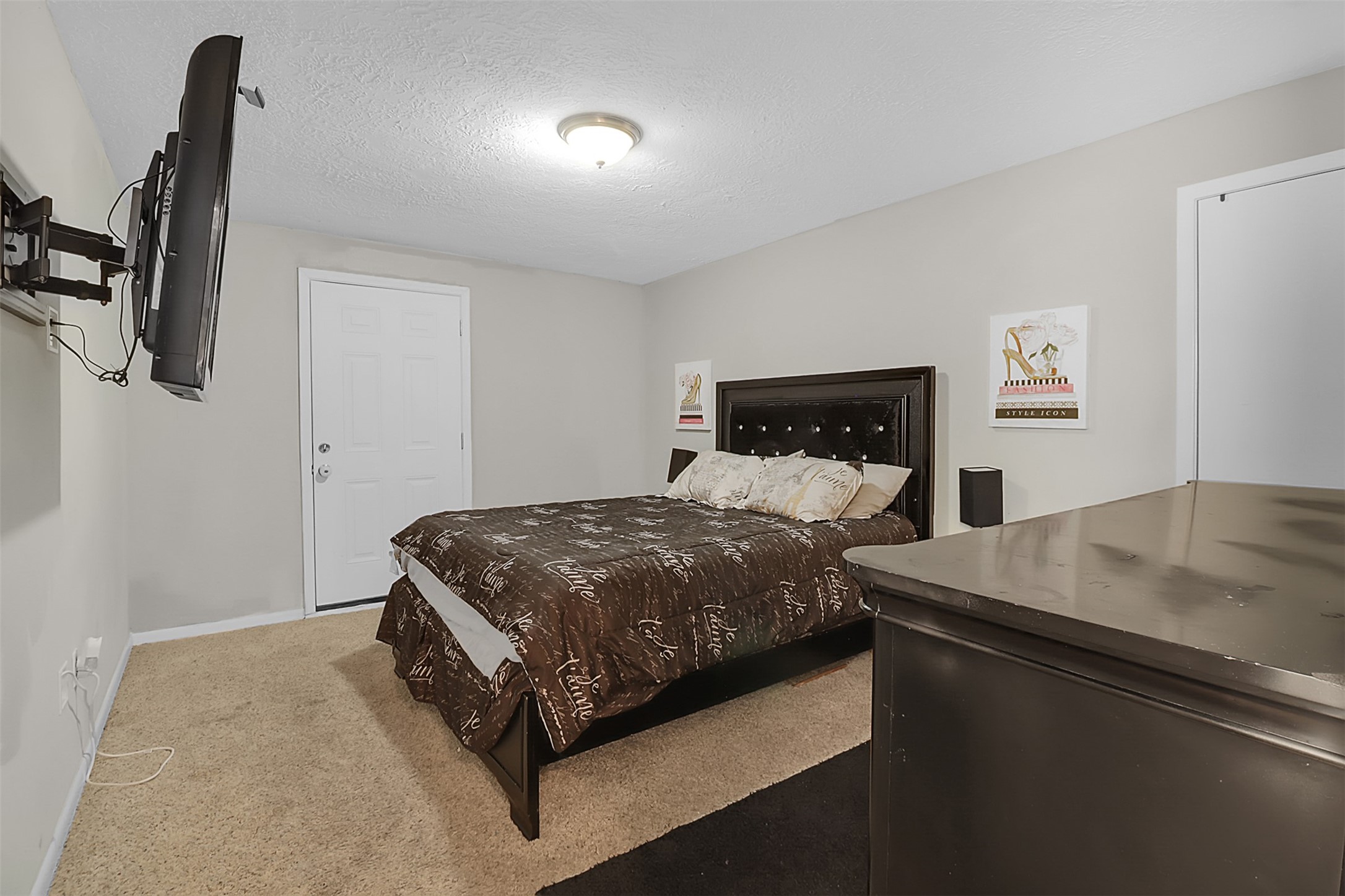110 South 9th Street Highlands, TX 77562 - Photo 16 of 22 a bedroom with a bed and window