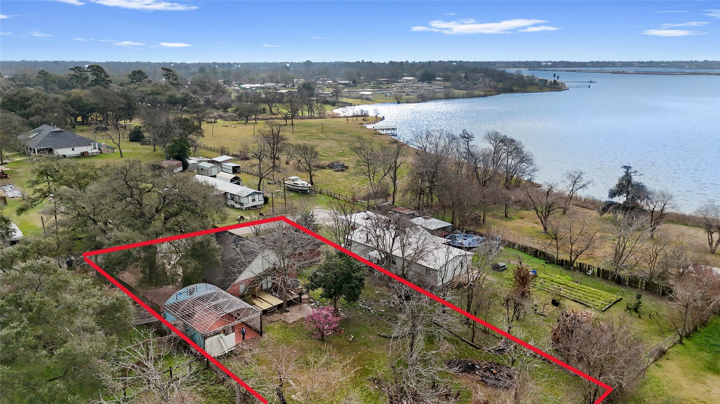 110 South 9th Street Highlands, TX 77562 - Photo 20 of 22 a view of a lake with a mountain in the background