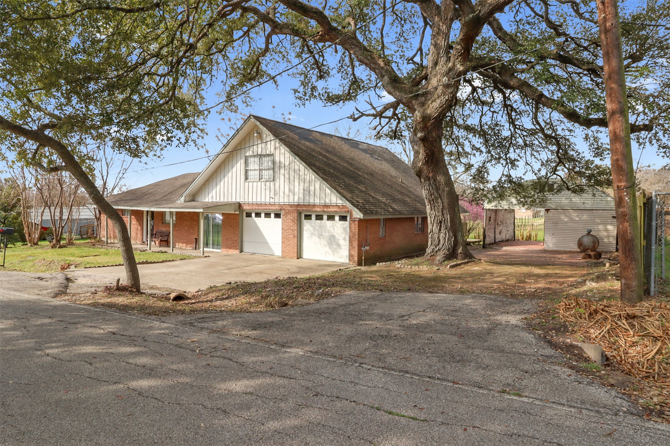 110 South 9th Street Highlands, TX 77562 - Photo 22 of 22 a front view of a house with a yard and garage