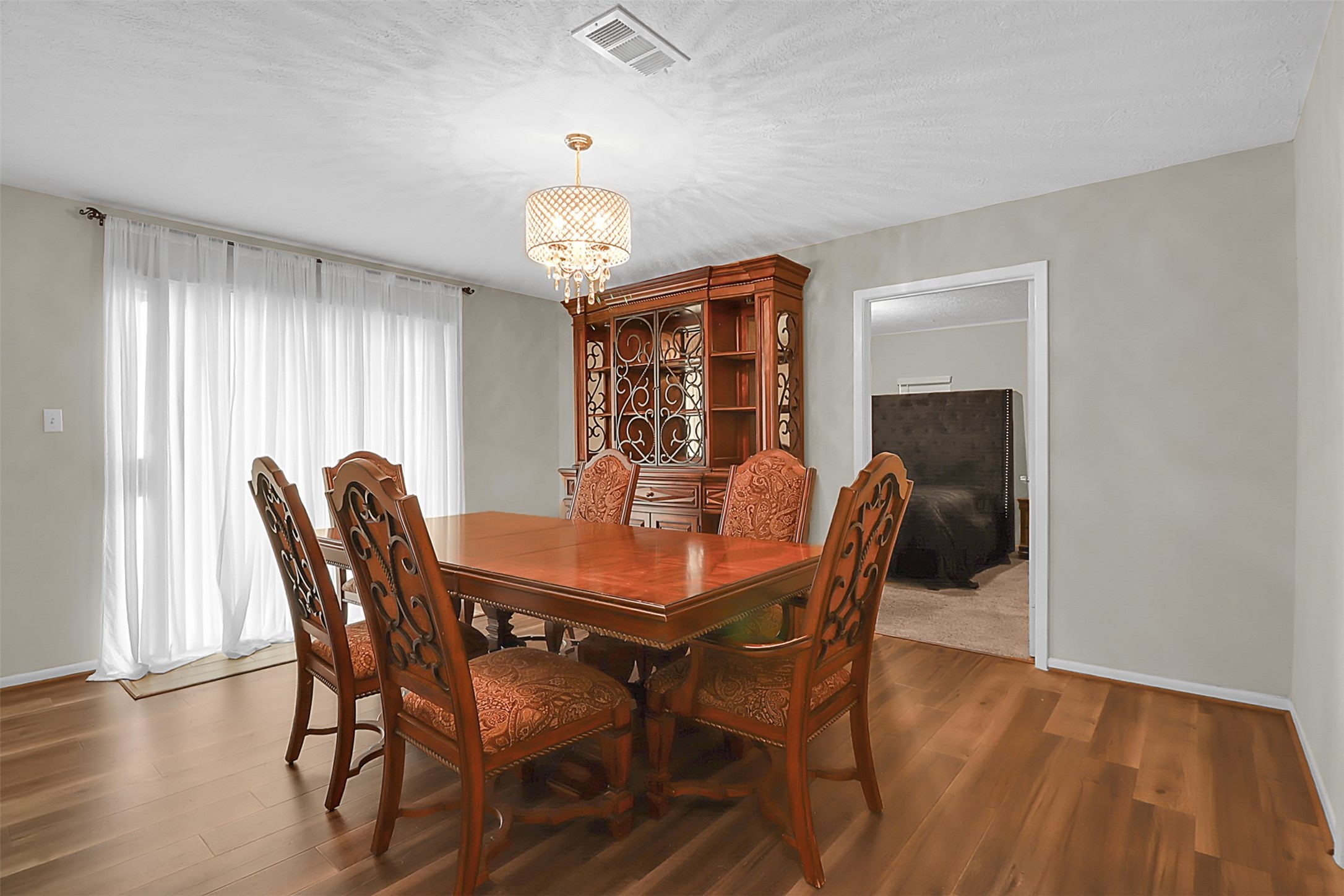 110 South 9th Street Highlands, TX 77562 - Photo 8 of 22 a view of a dining room with furniture window and wooden floor