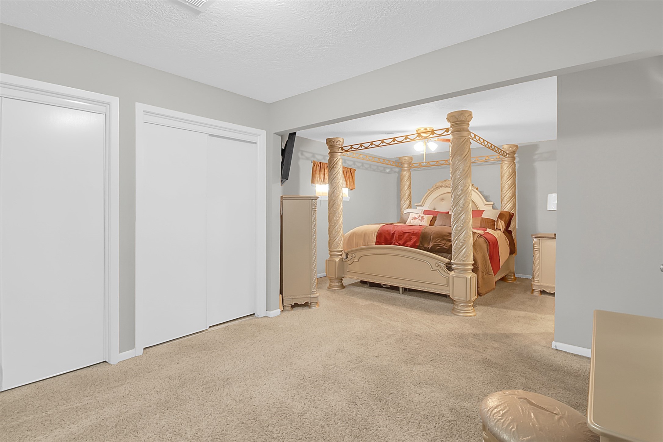 110 South 9th Street Highlands, TX 77562 - Photo 9 of 22 a bedroom with a bed and a lamp