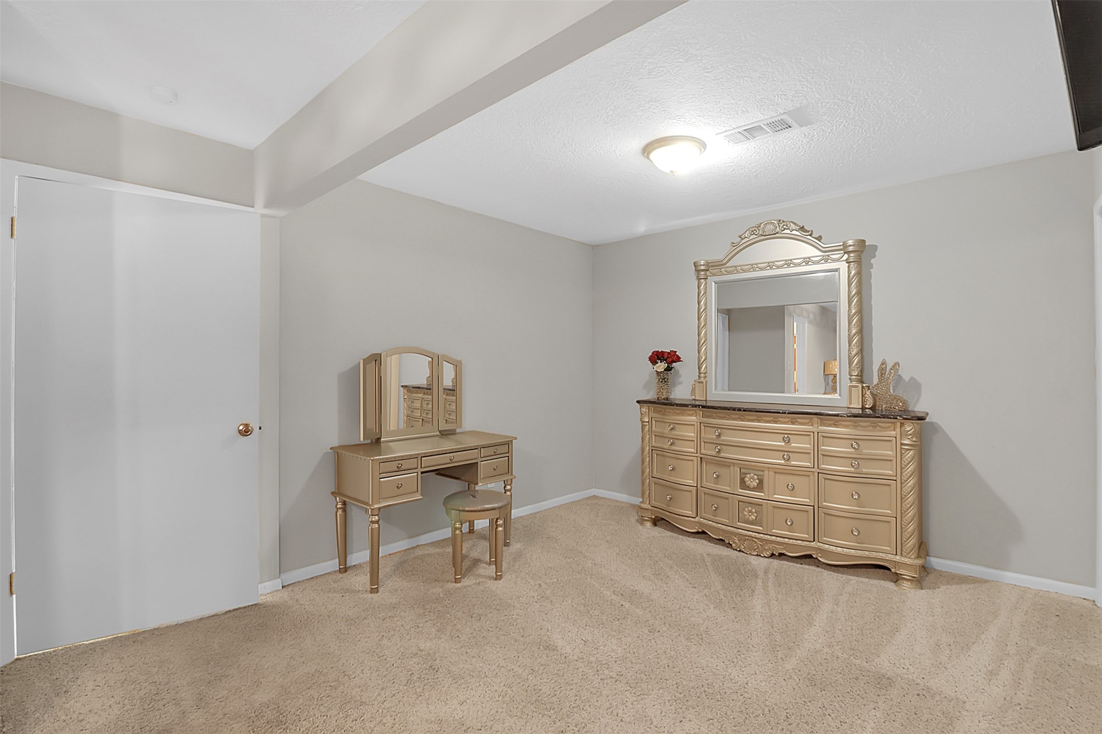 110 South 9th Street Highlands, TX 77562 - Photo 10 of 22 a room with furniture and a dresser