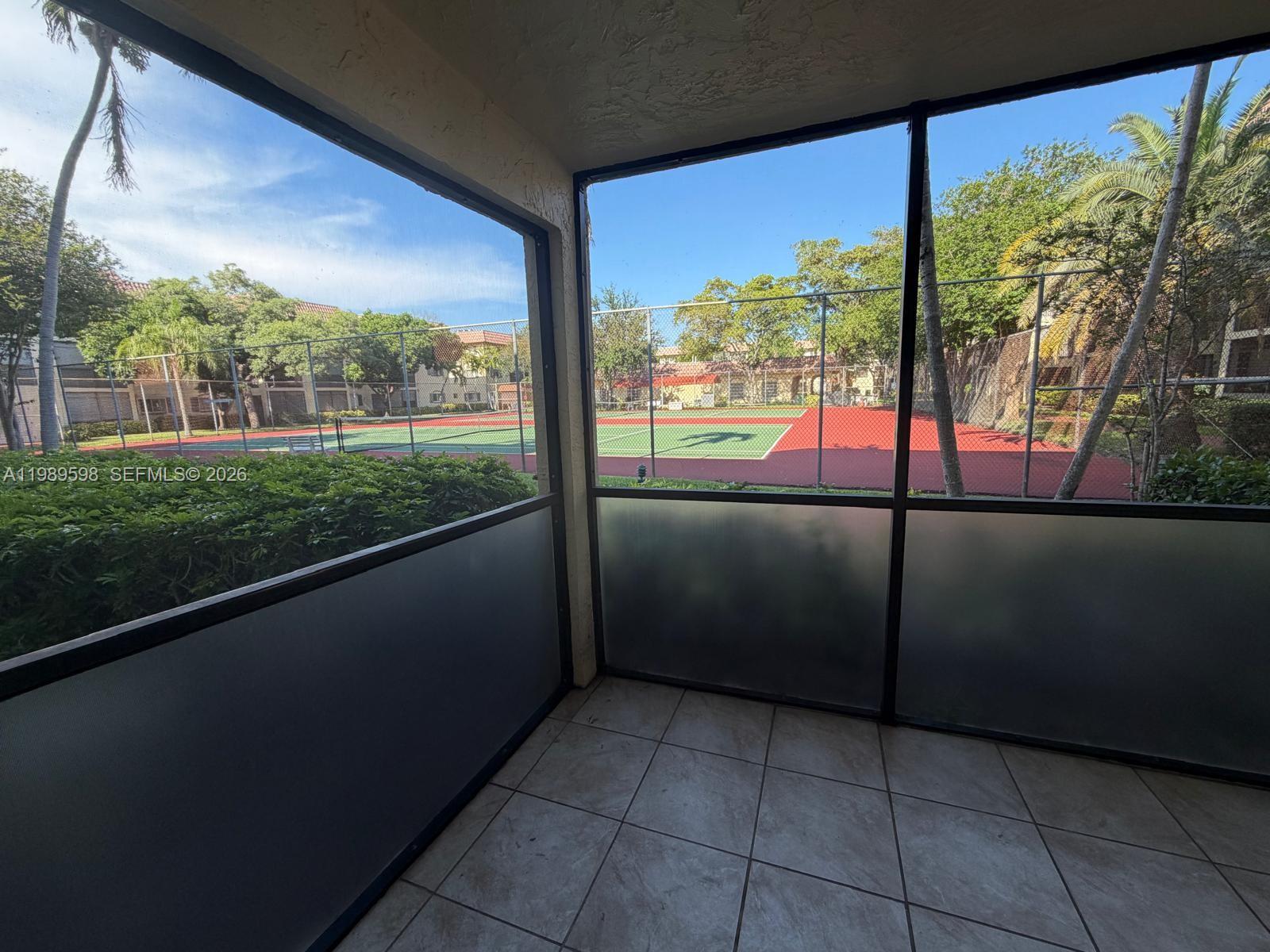 253 South Cypress Road, Unit 214 Pompano Beach, FL 33060 - Photo 4 of 25 a view of a city from a balcony