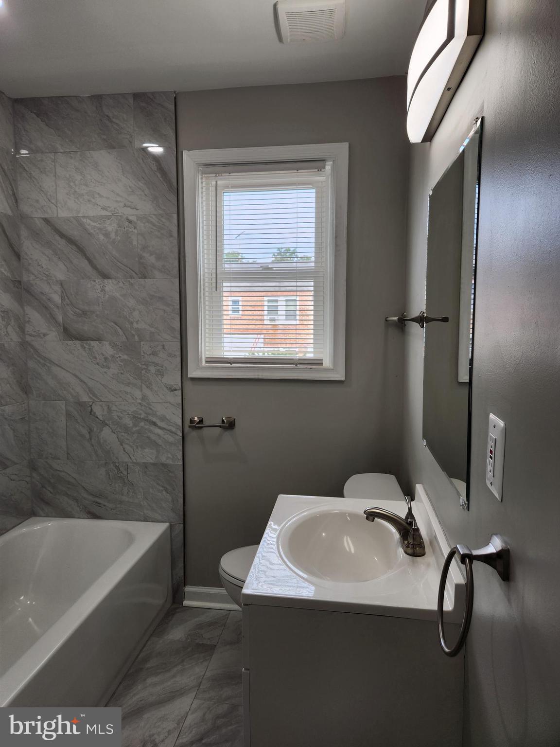 4113 Century Road Baltimore, MD 21206 - Photo 10 of 27 a bathroom with a sink a toilet and bathtub