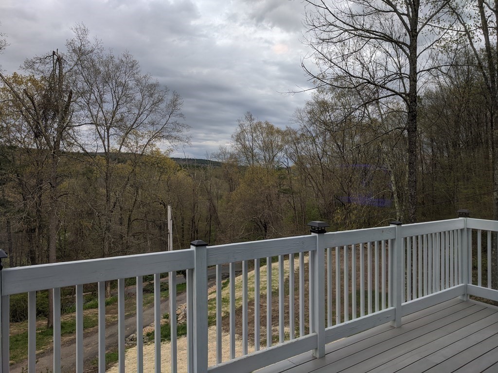 276 Old Gilbertville Road Ware, MA 01082 - Photo 3 of 42 a view of a wooden roof deck