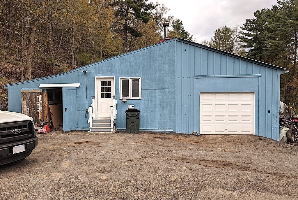 276 Old Gilbertville Road Ware, MA 01082 - Photo 31 of 42 a view of a house with a garage and yard