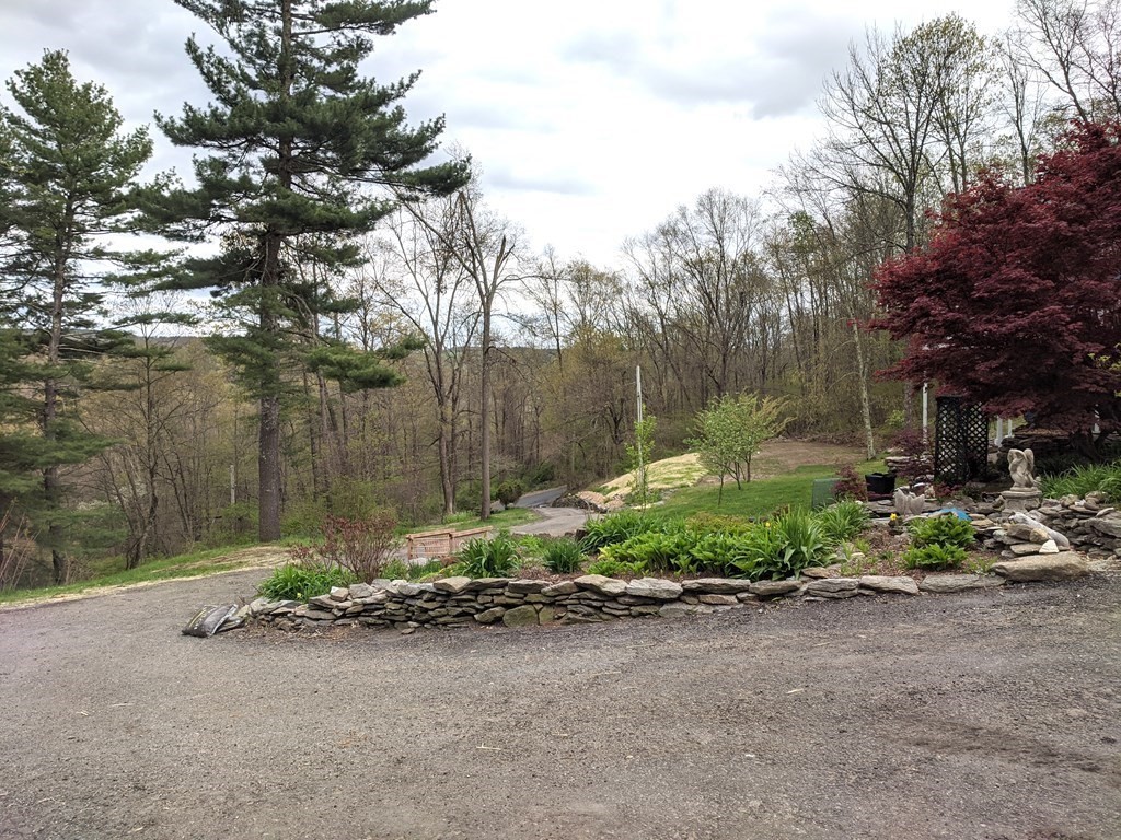 276 Old Gilbertville Road Ware, MA 01082 - Photo 40 of 42 a backyard of a house with a yard and outdoor seating