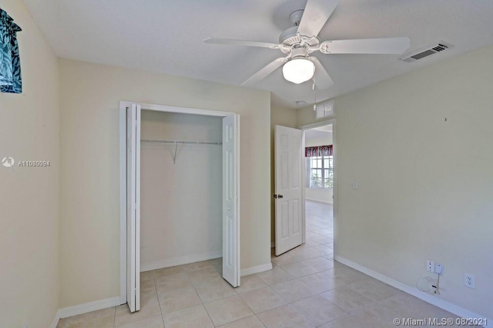918 Southwest Longfellow Road, Unit 918 Port St. Lucie, FL 34953 - Photo 29 of 53 wooden floor in an empty room
