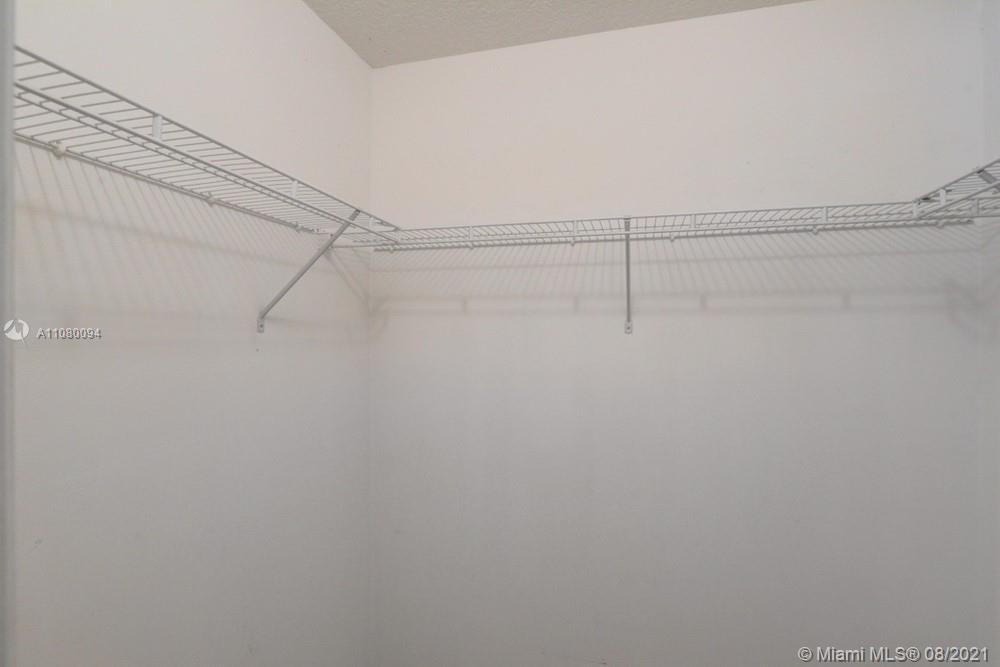 918 Southwest Longfellow Road, Unit 918 Port St. Lucie, FL 34953 - Photo 39 of 53 a view of a room with racks on the wall
