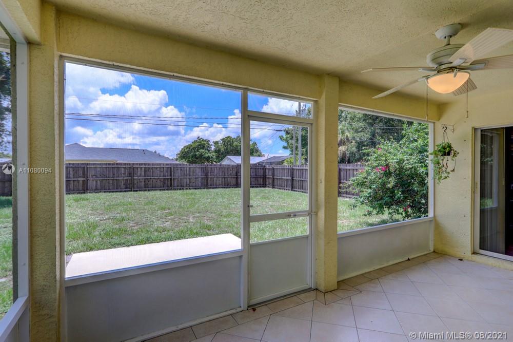 918 Southwest Longfellow Road, Unit 918 Port St. Lucie, FL 34953 - Photo 45 of 53 a view of backyard with green space and tub