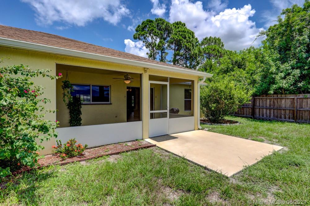918 Southwest Longfellow Road, Unit 918 Port St. Lucie, FL 34953 - Photo 46 of 53 a front view of a house with garden