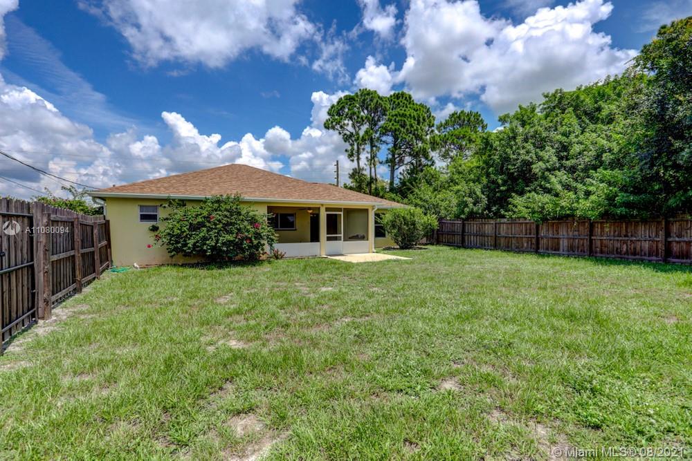 918 Southwest Longfellow Road, Unit 918 Port St. Lucie, FL 34953 - Photo 51 of 53 a view of house with yard and entertaining space