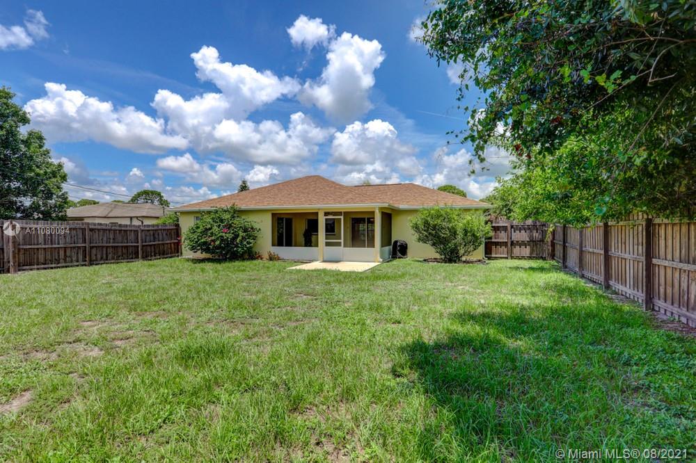 918 Southwest Longfellow Road, Unit 918 Port St. Lucie, FL 34953 - Photo 53 of 53 a view of house with backyard
