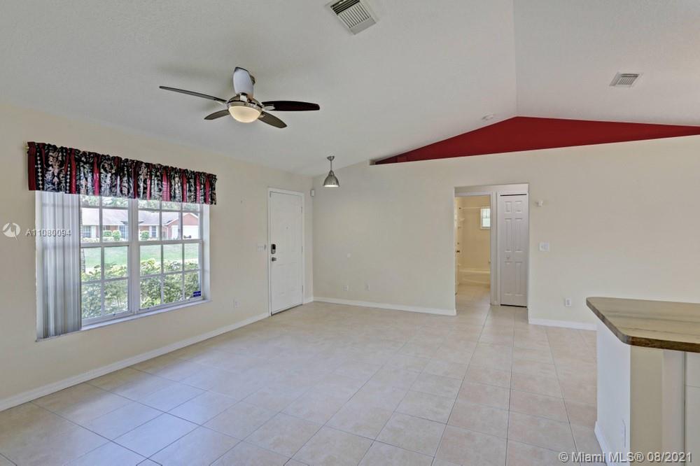 918 Southwest Longfellow Road, Unit 918 Port St. Lucie, FL 34953 - Photo 9 of 53 a view of an empty room with a window