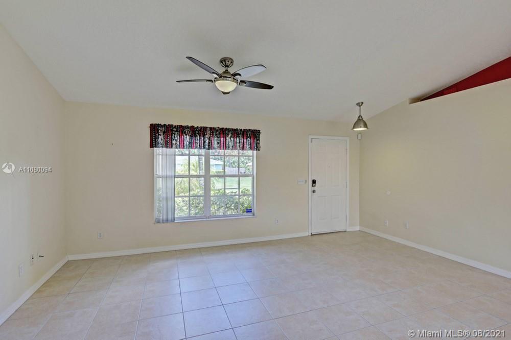 918 Southwest Longfellow Road, Unit 918 Port St. Lucie, FL 34953 - Photo 10 of 53 a view of an empty room with a window