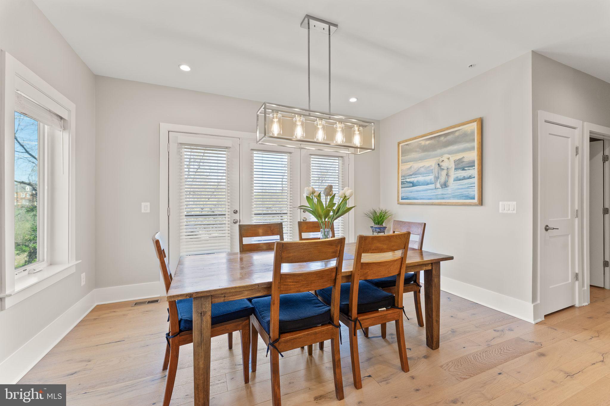20052 Old Line Terrace Ashburn, VA 20147 - Photo 14 of 67 a view of a dining room with furniture window and wooden floor