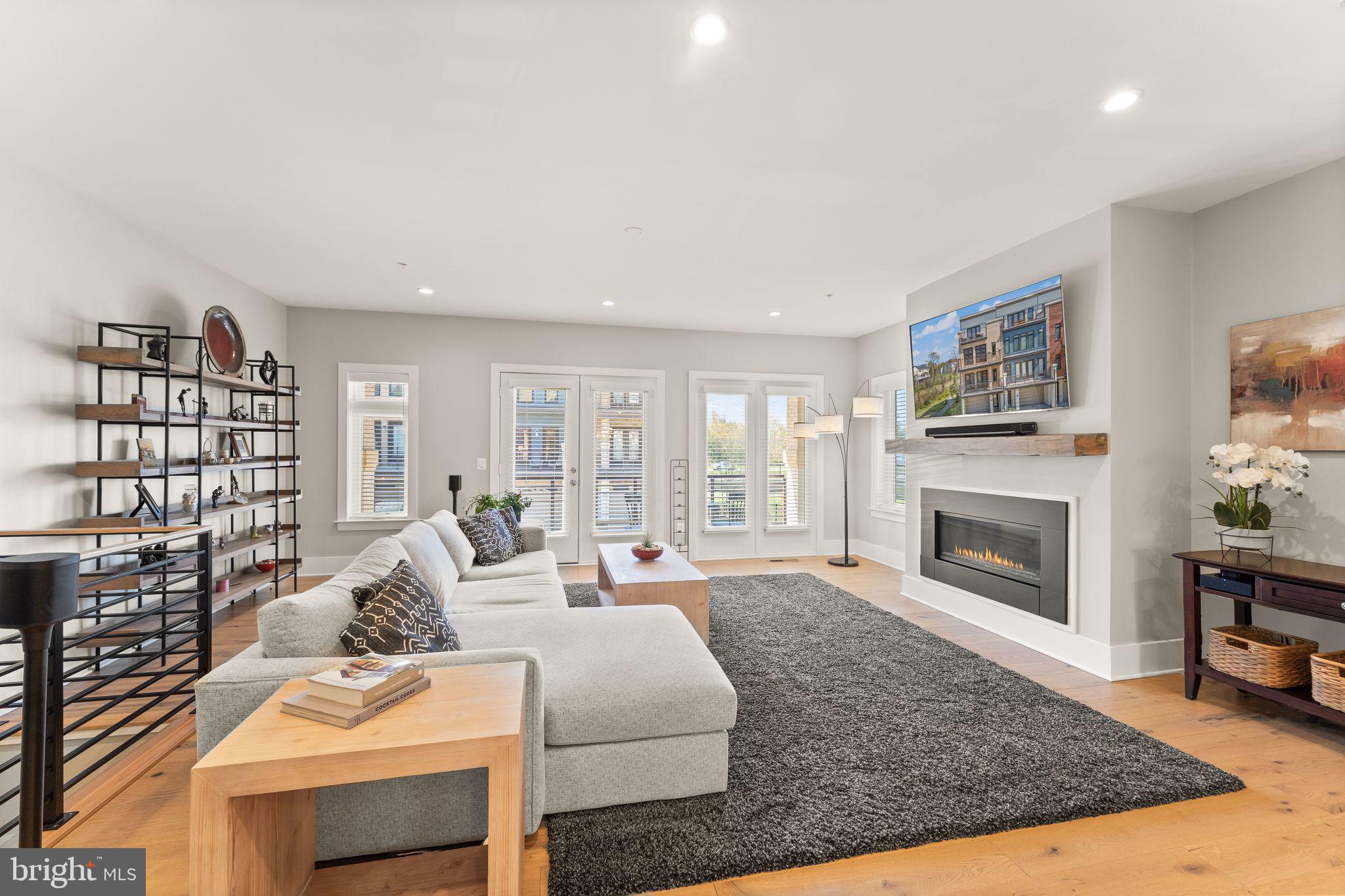 20052 Old Line Terrace Ashburn, VA 20147 - Photo 18 of 67 a living room with furniture large window and fireplace