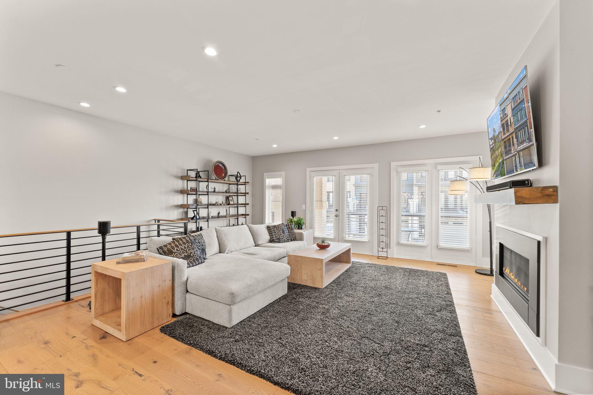 20052 Old Line Terrace Ashburn, VA 20147 - Photo 20 of 67 a bed room with furniture and a fireplace