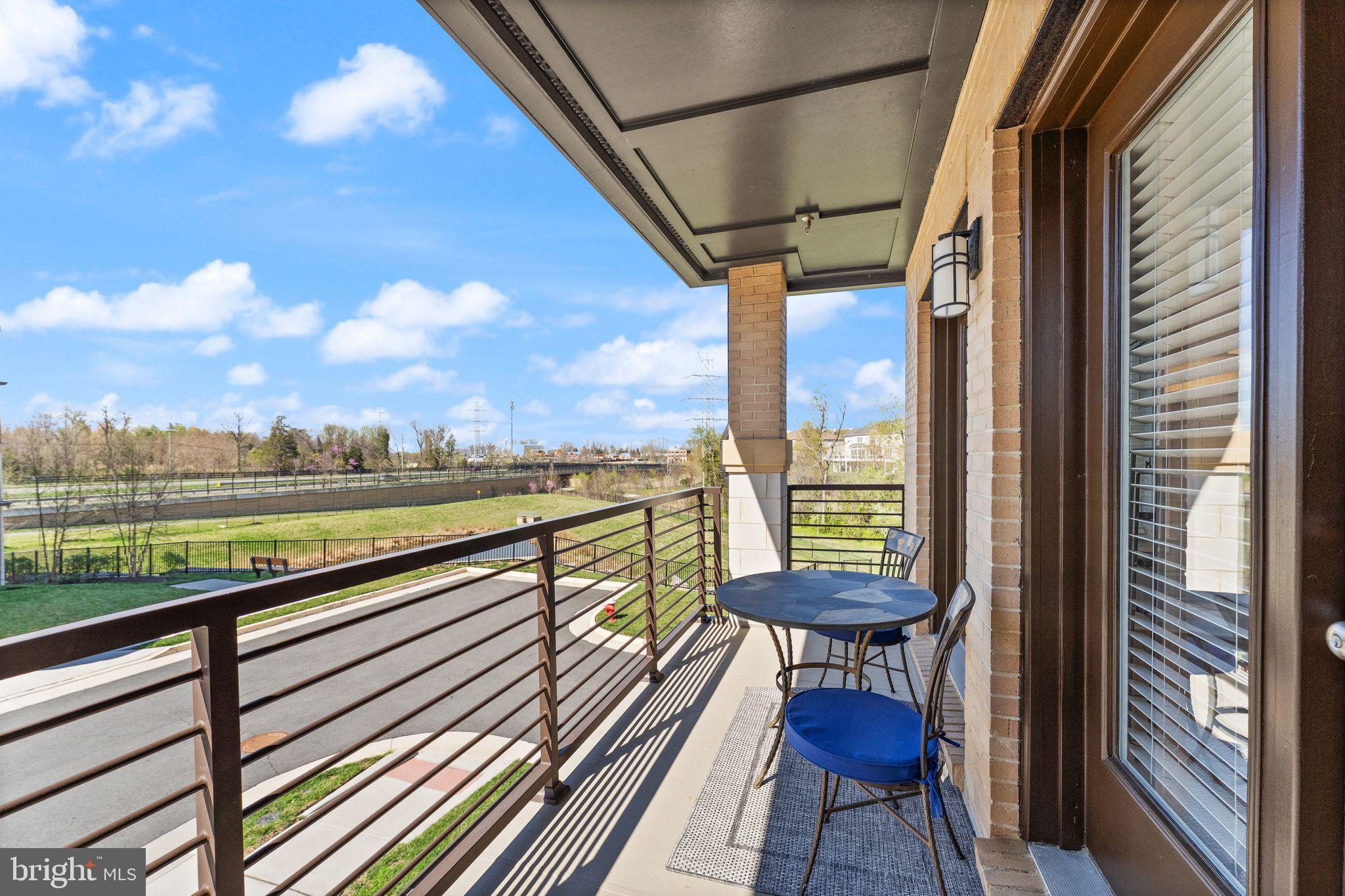 20052 Old Line Terrace Ashburn, VA 20147 - Photo 24 of 67 a view of a city from a balcony with furniture