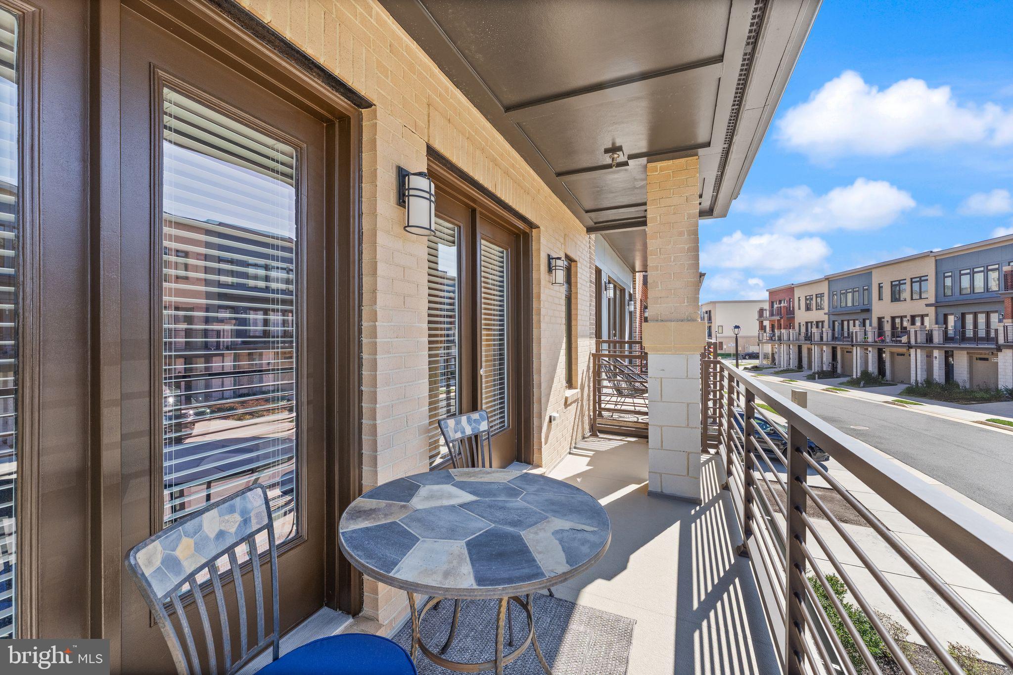 20052 Old Line Terrace Ashburn, VA 20147 - Photo 25 of 67 a view of a balcony and chairs