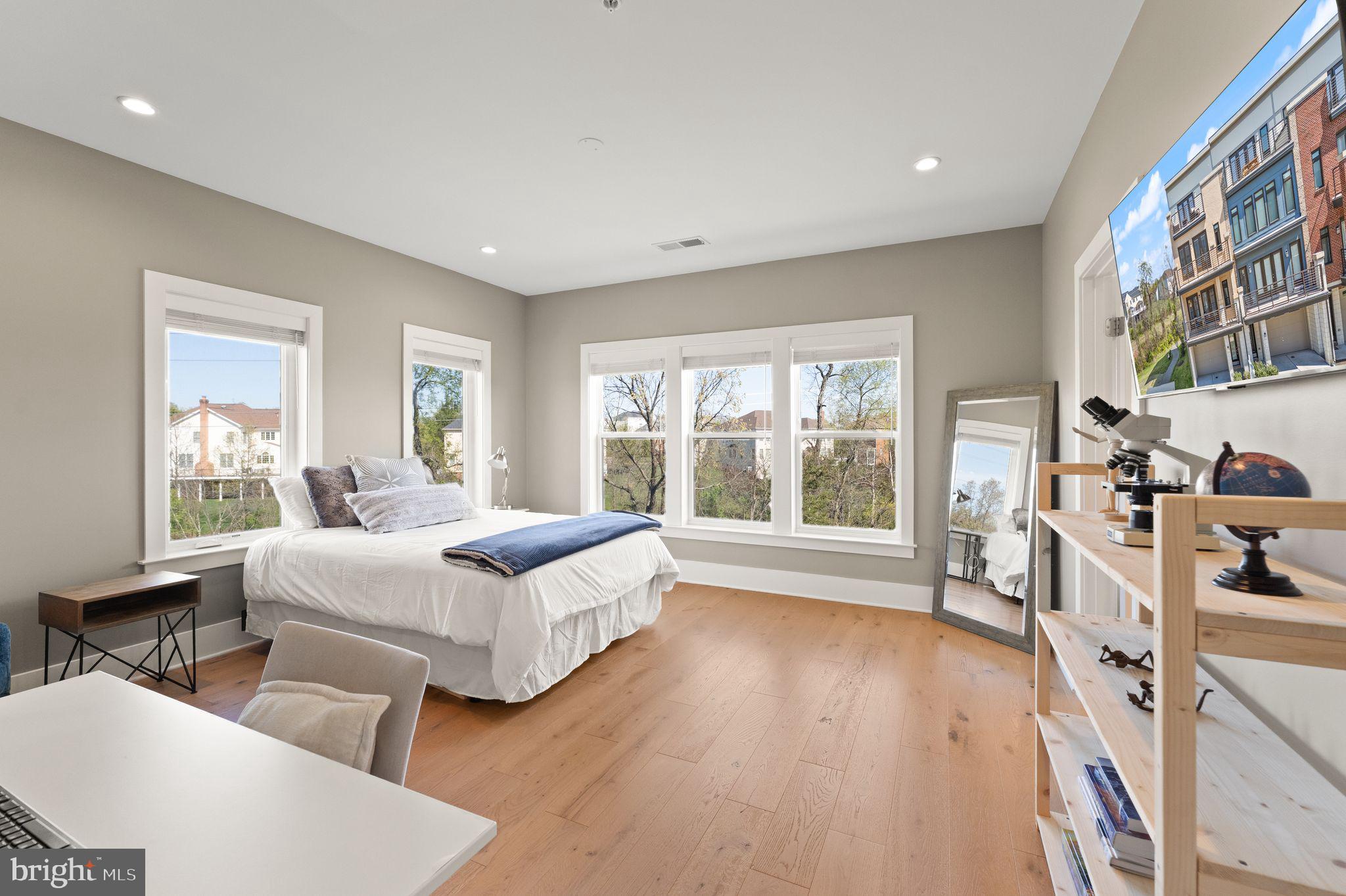 20052 Old Line Terrace Ashburn, VA 20147 - Photo 36 of 67 a spacious bedroom with two beds and a large window
