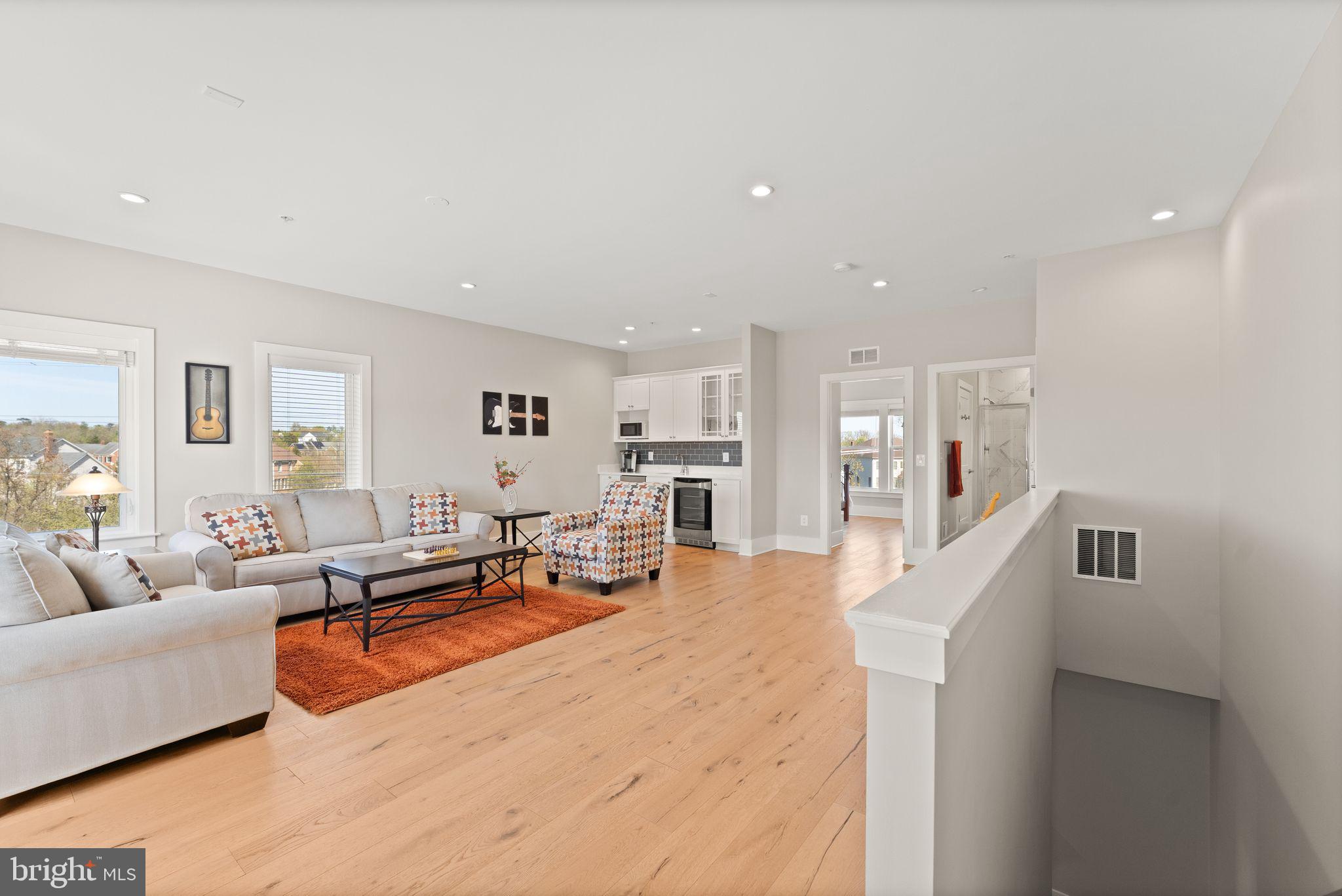 20052 Old Line Terrace Ashburn, VA 20147 - Photo 43 of 67 a living room with furniture and a table