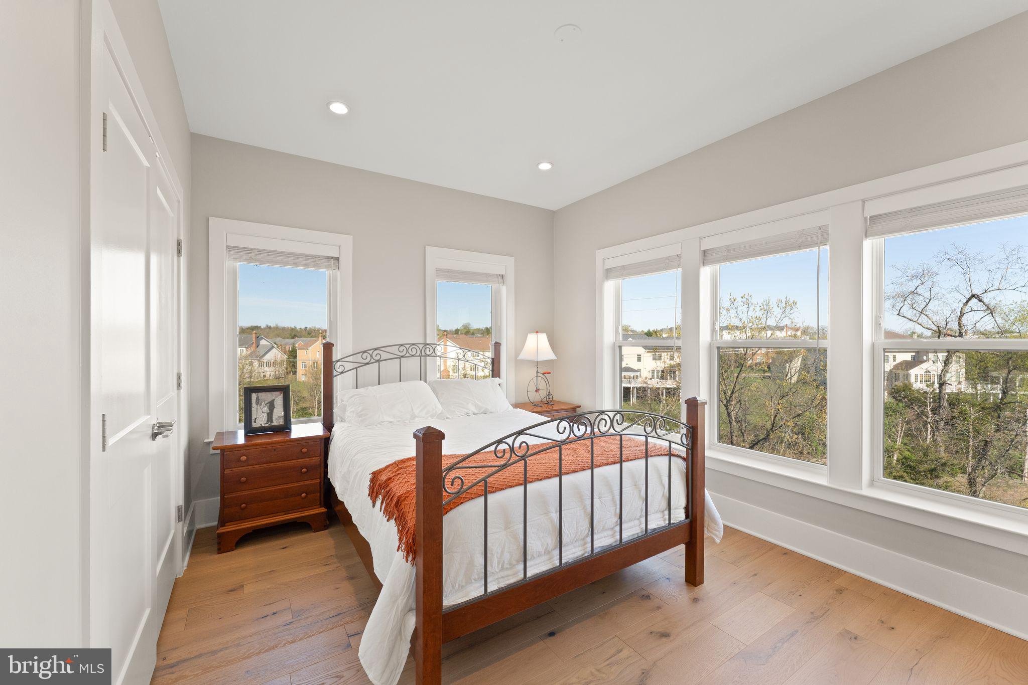20052 Old Line Terrace Ashburn, VA 20147 - Photo 49 of 67 a bedroom with a bed and a large window