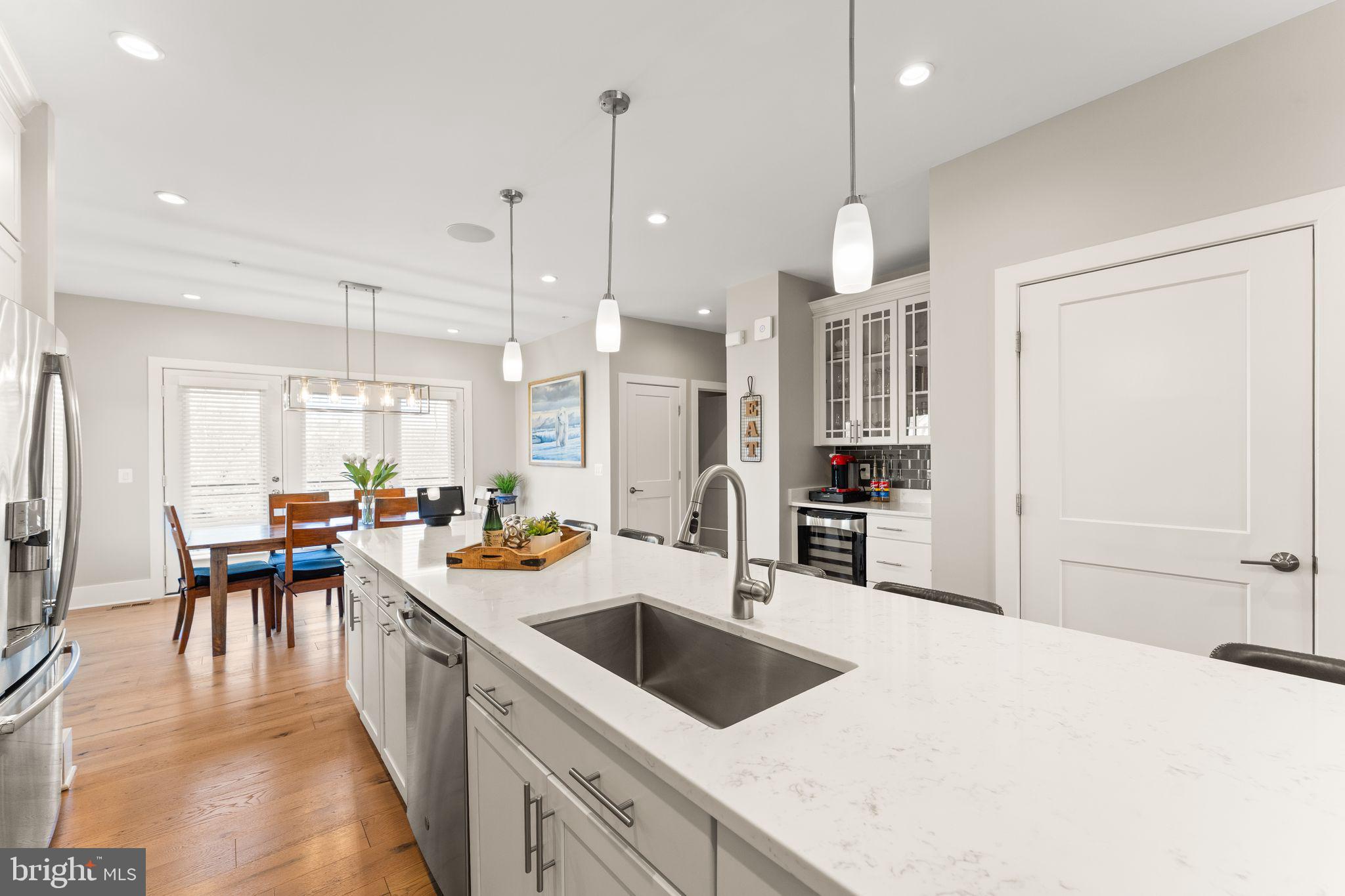 20052 Old Line Terrace Ashburn, VA 20147 - Photo 10 of 67 a kitchen that has a lot of cabinets a sink and appliances in it