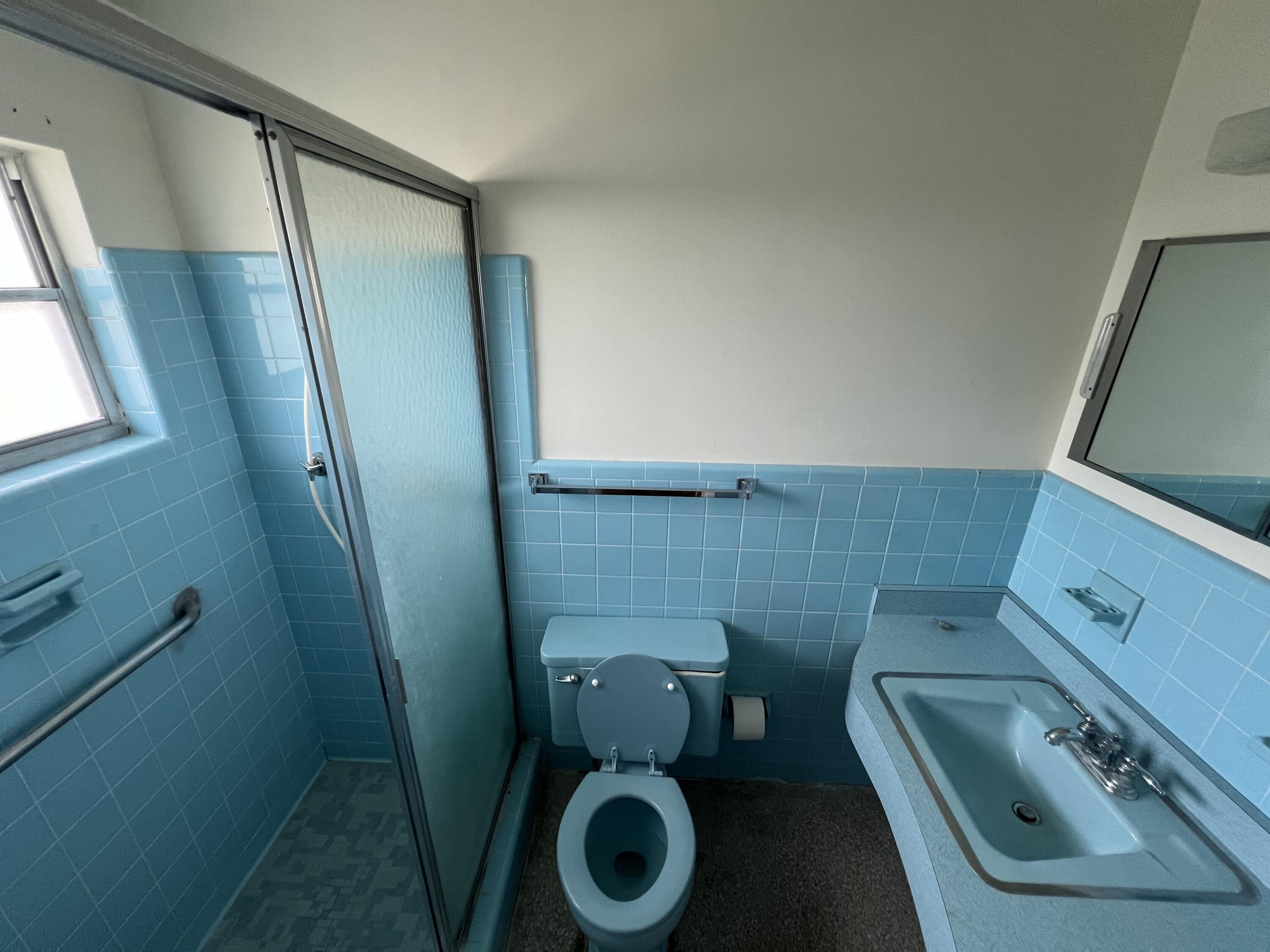 1908 Colonial Road Fort Pierce, FL 34950 - Photo 12 of 14 a bathroom with a toilet and a sink