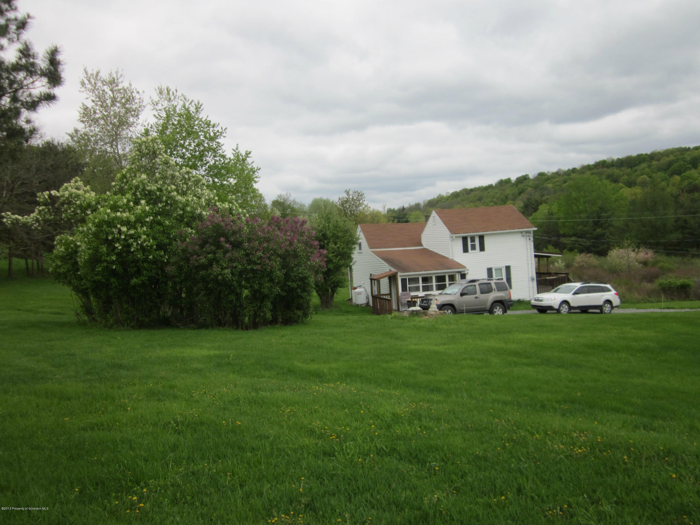 3362 Carter Road Montrose, PA 18801 - Photo 3 of 9 a house view with a garden space