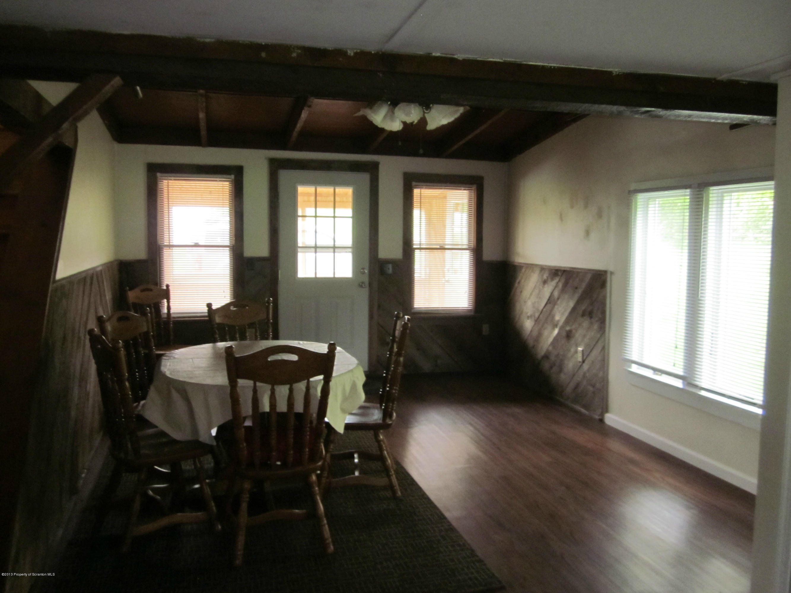 3362 Carter Road Montrose, PA 18801 - Photo 8 of 9 a view of a livingroom with furniture window and wooden floor