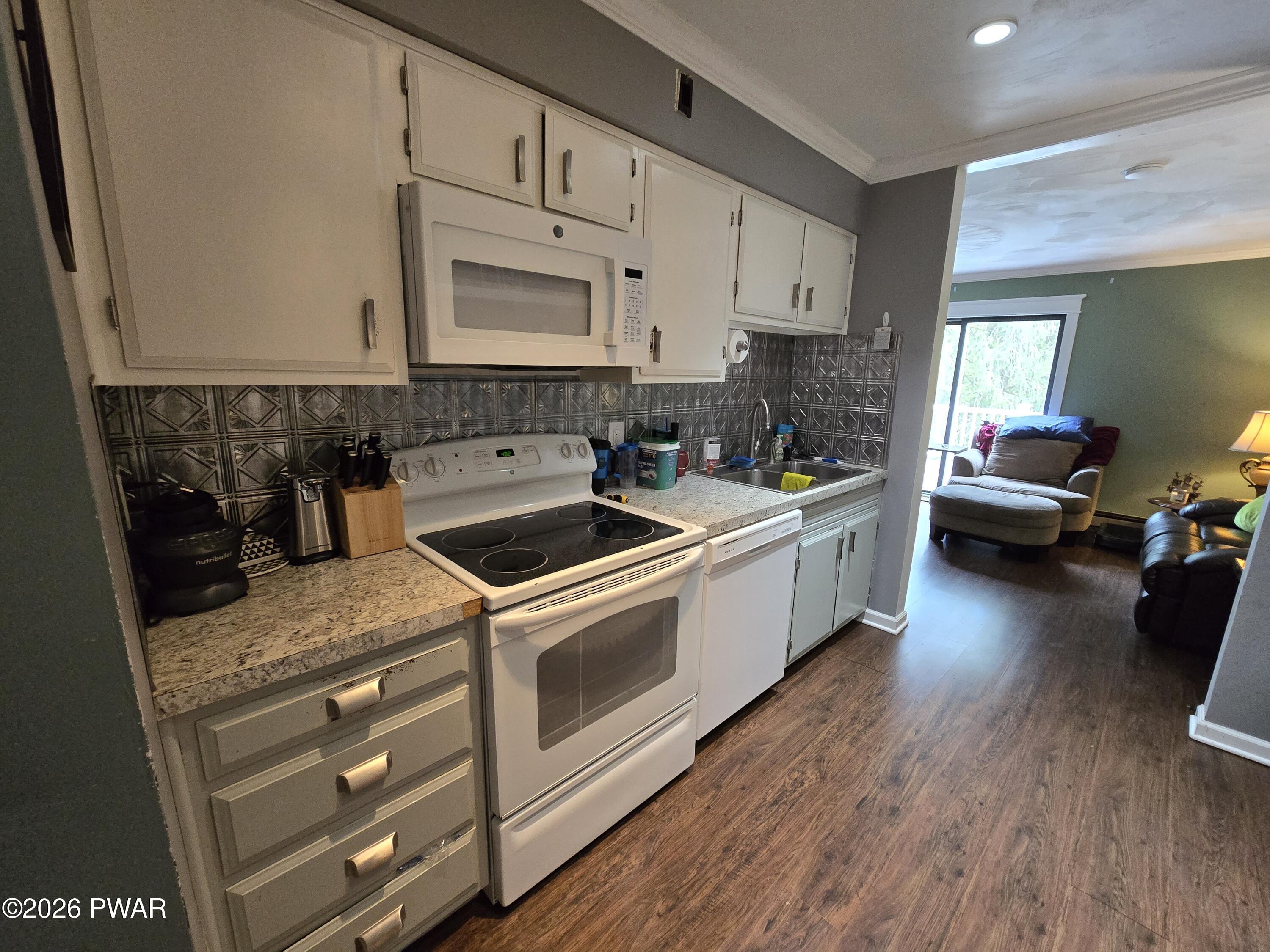 107 Keystone Hls Road, Unit 404 Factoryville, PA 18419 - Photo 17 of 23 a kitchen with a sink a stove and cabinets