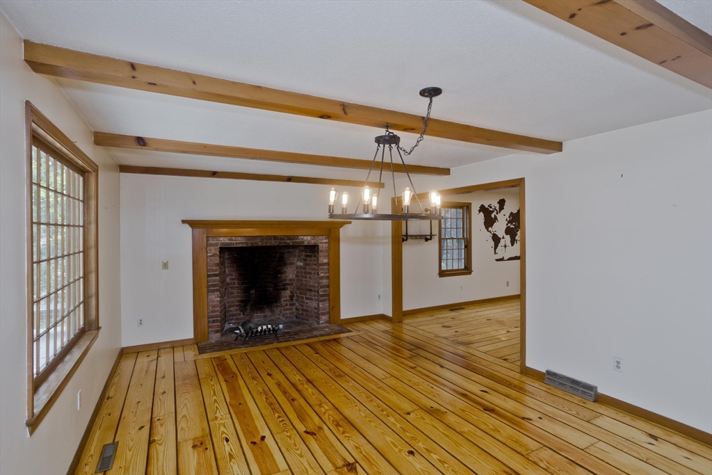 217 Inverness Lane Longmeadow, MA 01106 - Photo 16 of 42 a view of a livingroom with wooden floor and a kitchen