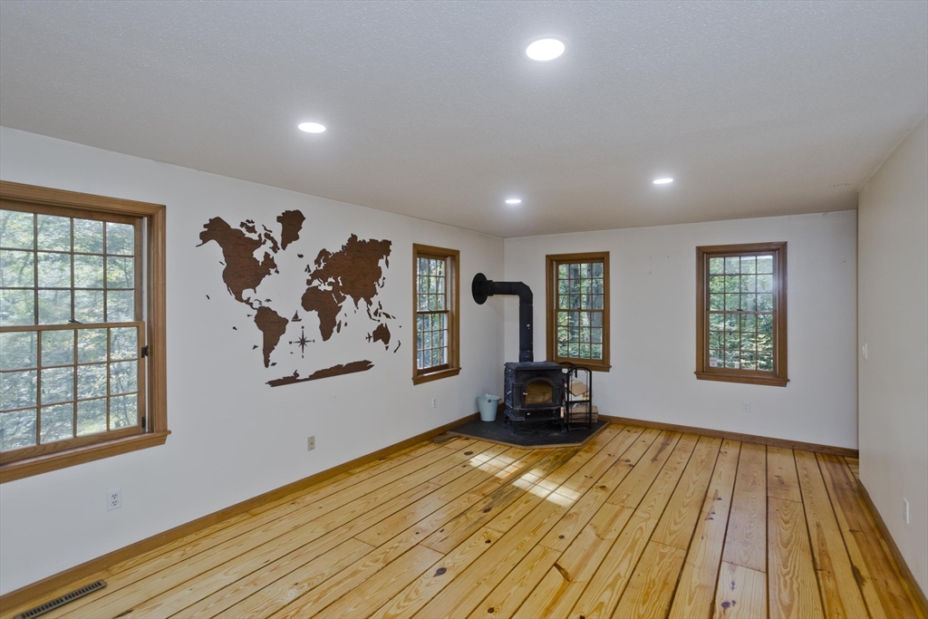217 Inverness Lane Longmeadow, MA 01106 - Photo 17 of 42 a view of a livingroom with wooden floor and a window