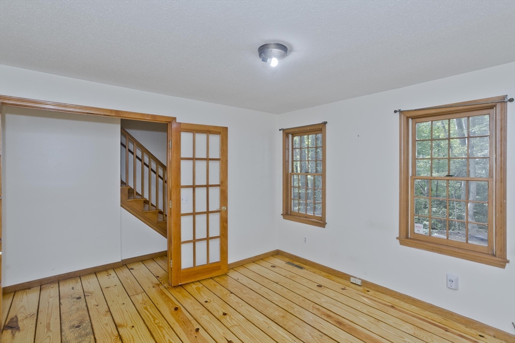 217 Inverness Lane Longmeadow, MA 01106 - Photo 20 of 42 a view of an empty room with wooden floor and a window