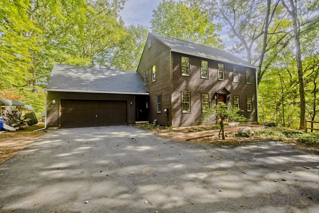 217 Inverness Lane Longmeadow, MA 01106 - Photo 2 of 42 a front view of a house with garden