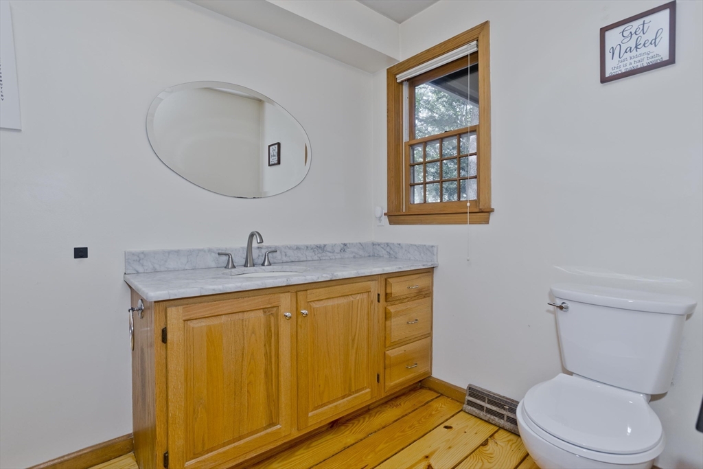 217 Inverness Lane Longmeadow, MA 01106 - Photo 21 of 42 a bathroom with a toilet sink and mirror